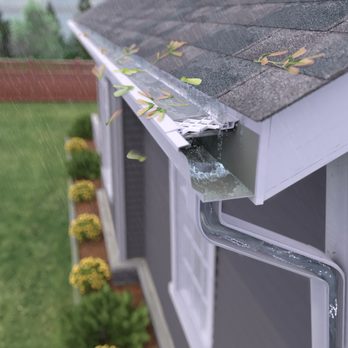 Water shedding off a gutter after ground-level cleaning without a ladder